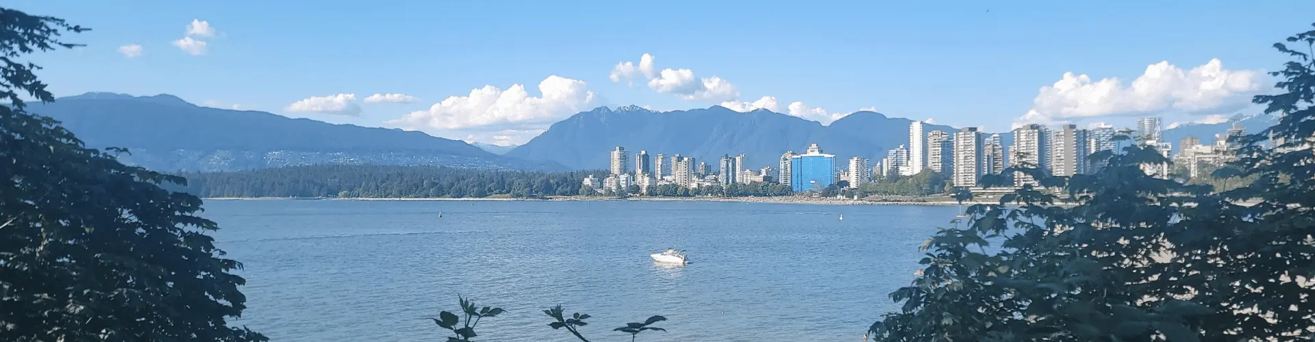 View of Vancouver across water with mountain background
